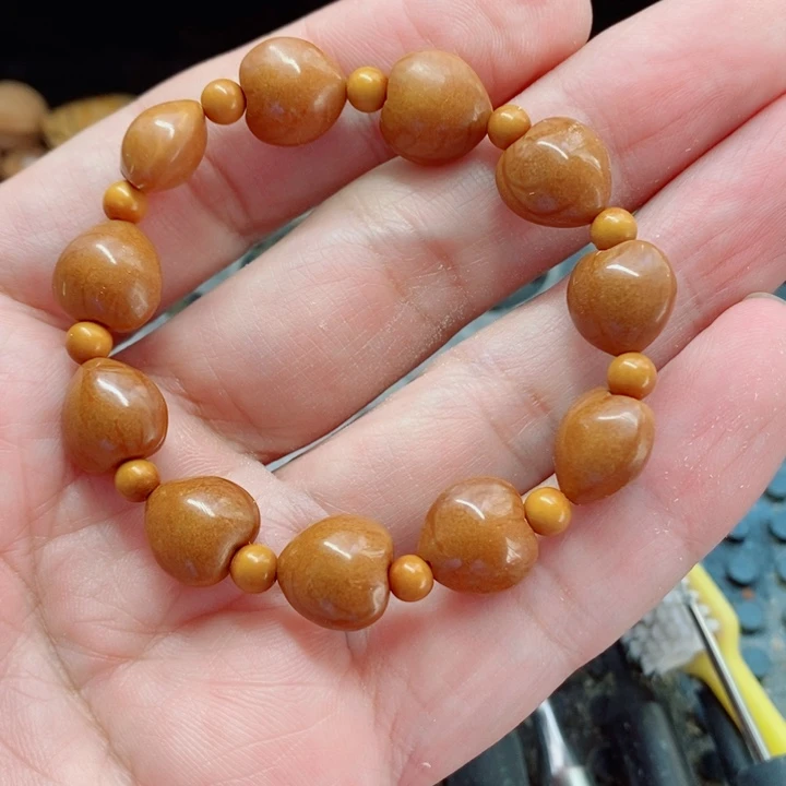 纯手工制作野生龙纹桃核心形手串