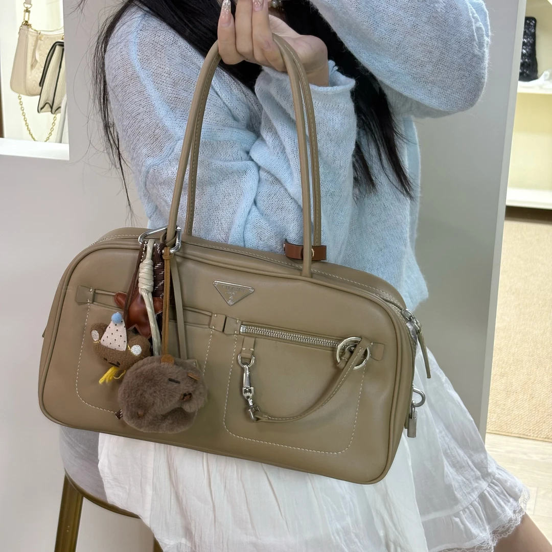 95新 Prada/普拉达 觅时三角标开口笑保龄球包