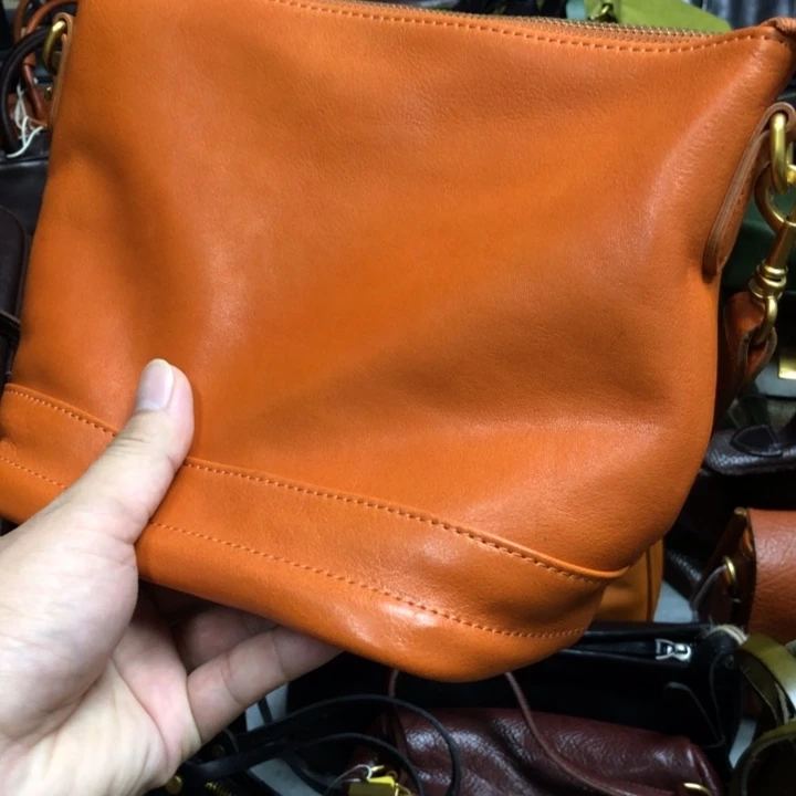 牛皮黄色水桶包包