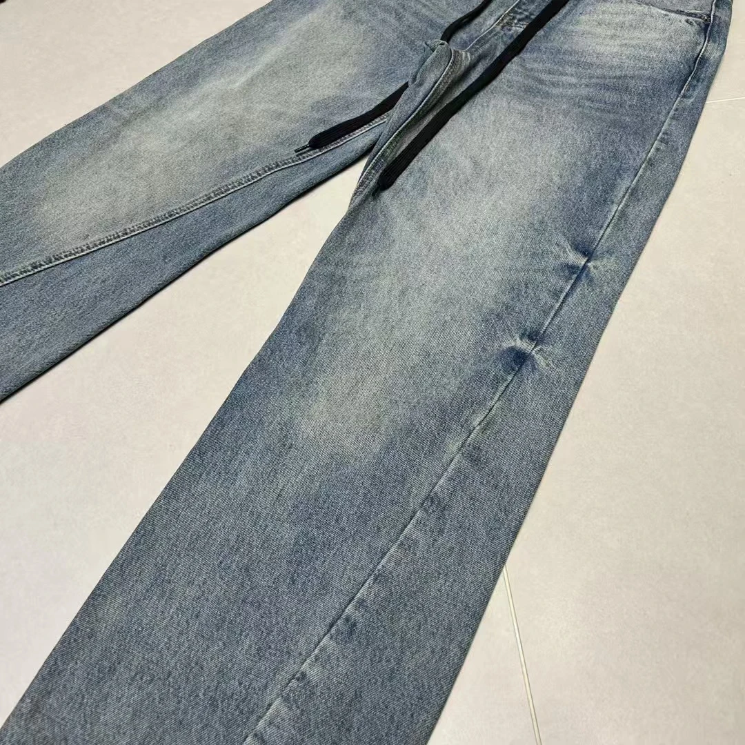 不规则裤脚毛边直筒牛仔裤