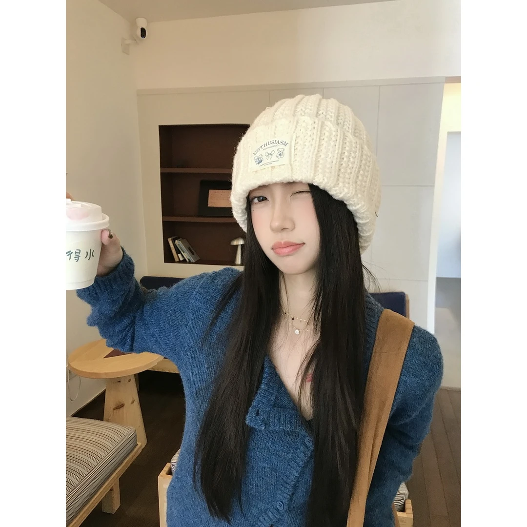 韩版绞花蝴蝶结贴标毛线帽女秋冬保暖堆堆冷帽显脸小包头帽