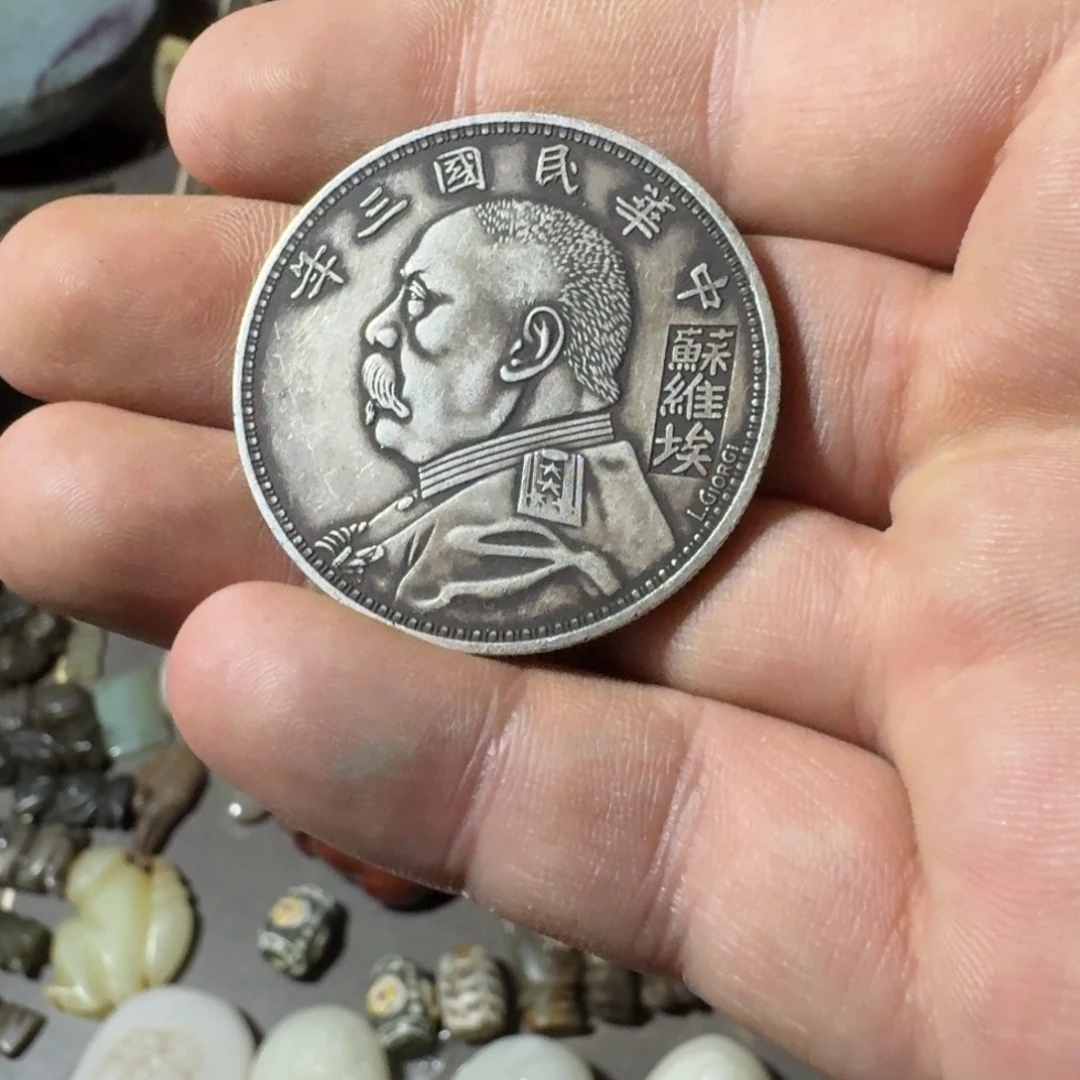 月***光金属大头工艺品1件