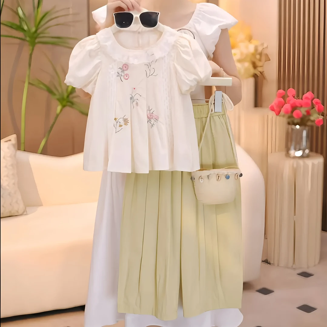 女童套装2025夏装设计款刺绣花边泡泡袖娃娃衫休闲九分裤两件套