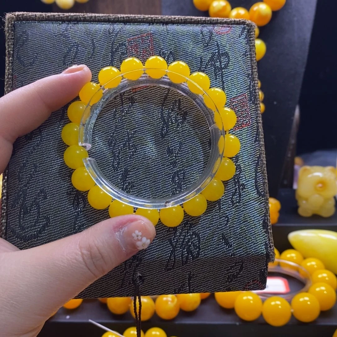 秋***淼非金属鸡油黄卡10全品手串