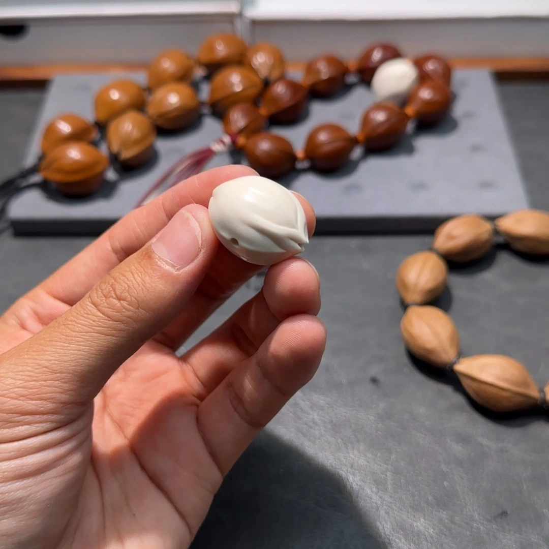 橄榄核手串1.9三通一颗