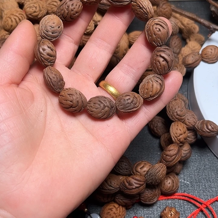 昱****桃核手串正宗桃枭手串