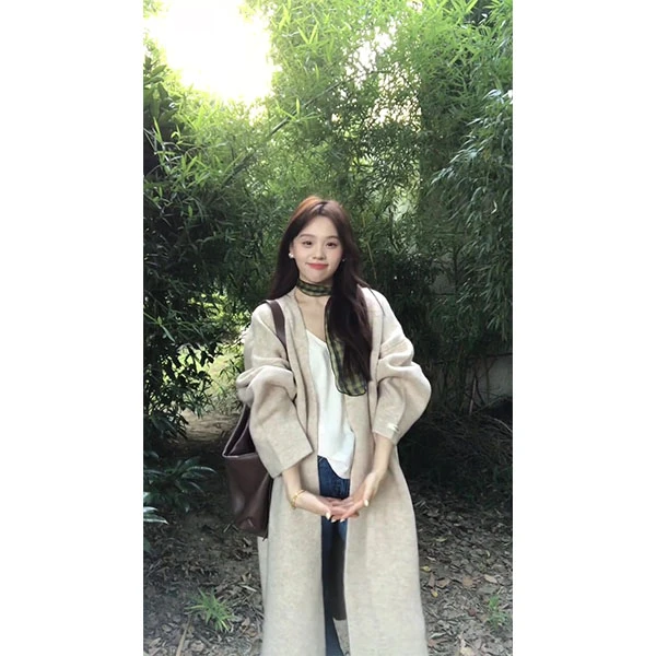 燕麦色针织开衫2025秋冬韩版加厚保暖毛衣过膝慵懒气质通勤长外套