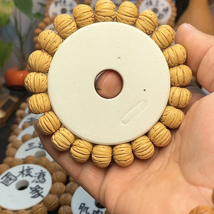 【闪购商品】用****5桃核手串纽扣手串