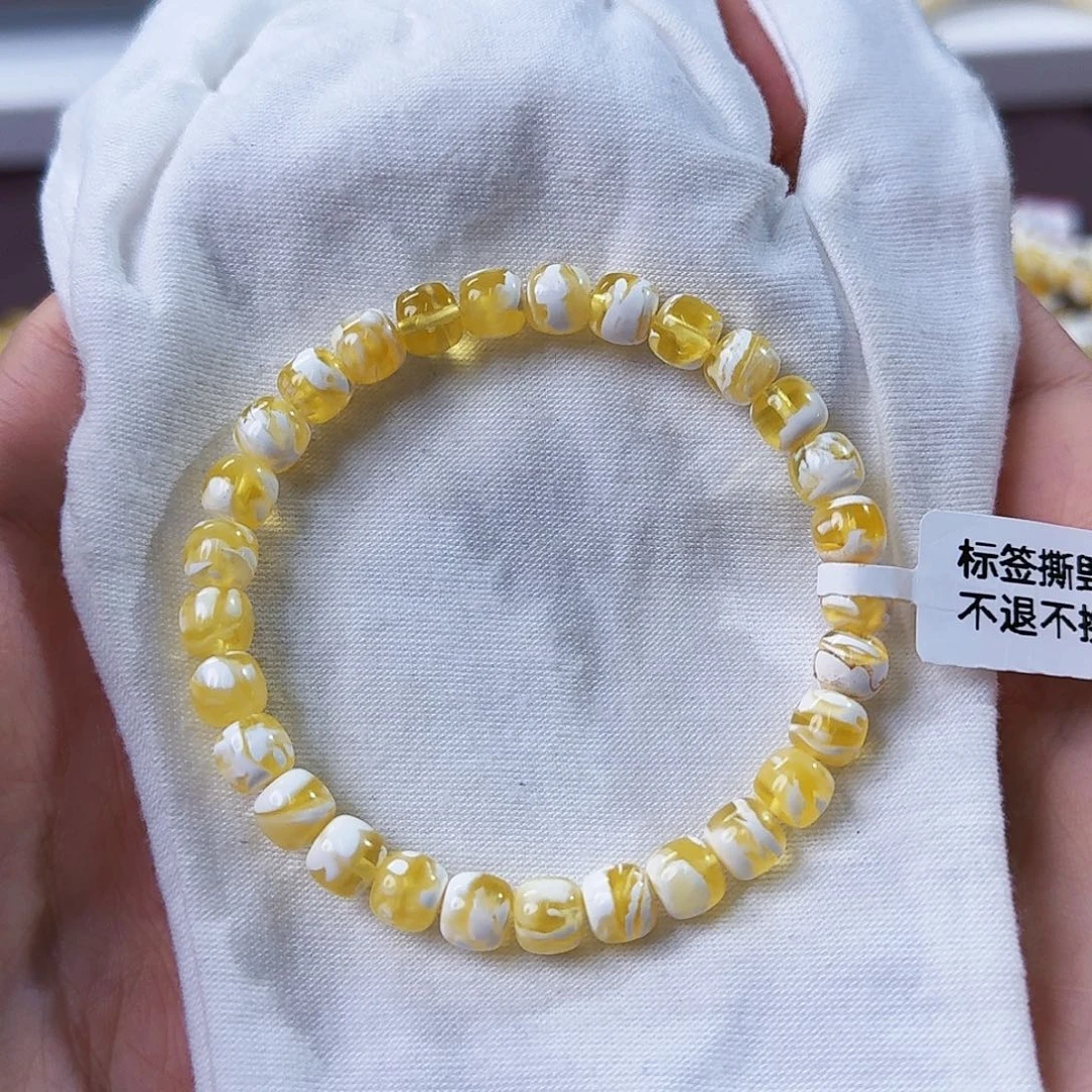 岁***安琥珀未镶嵌裸石7mm金漆白溶洞妖花