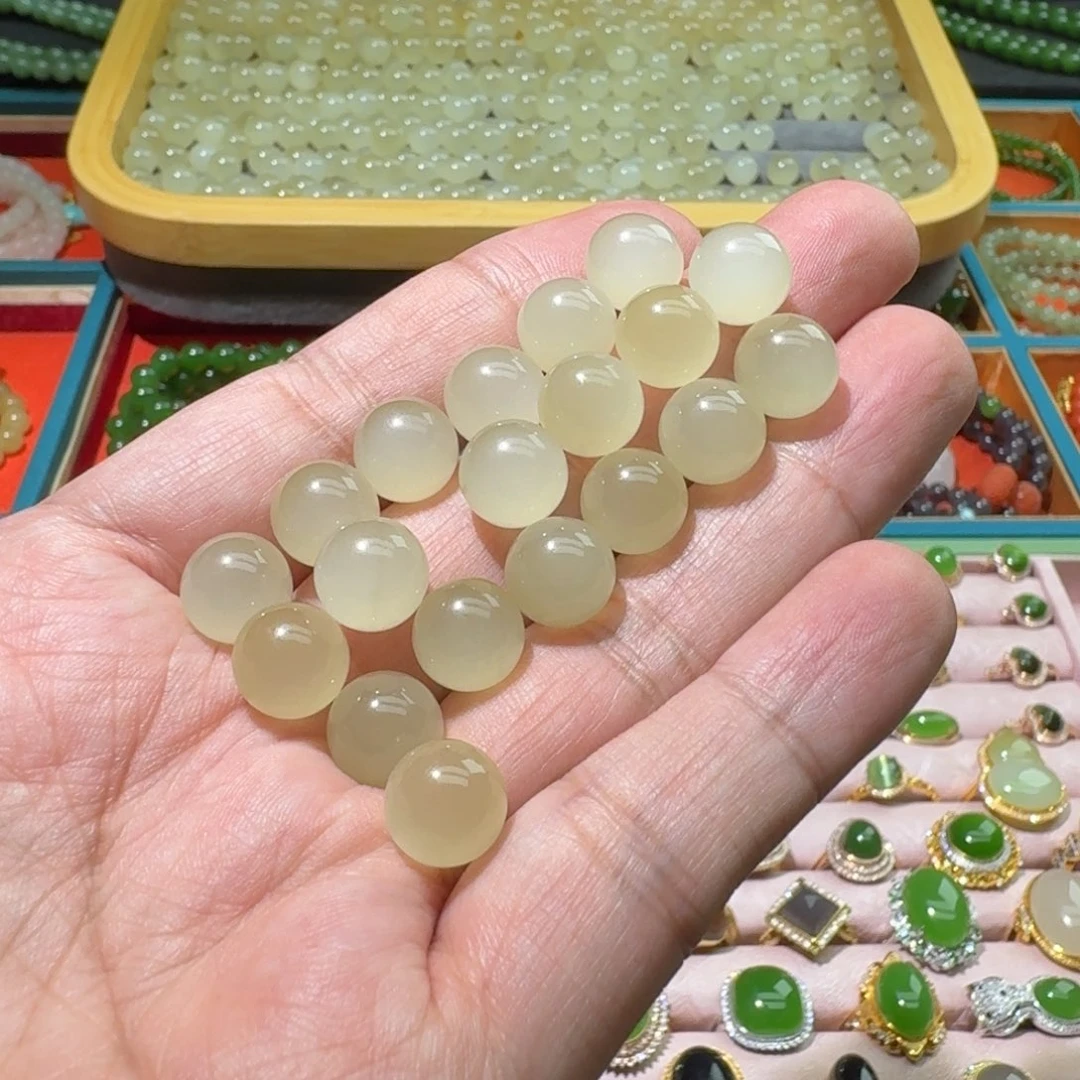 黑***K和田玉未镶嵌珠宝奇石蜂蜜水猫眼10mm单珠