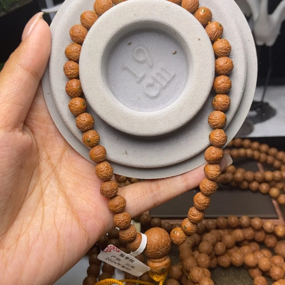 M***刘吊坠凤眼菩提铜钉镶嵌顶凤手持