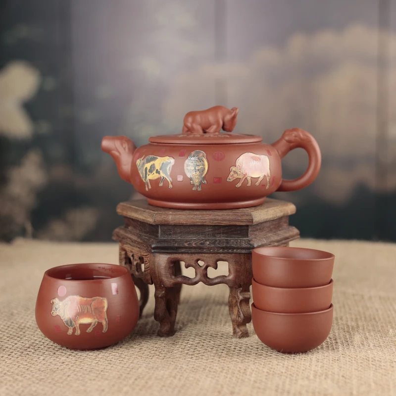 紫砂朱泥变色五牛图扭转乾坤壶(一壶四杯套装)