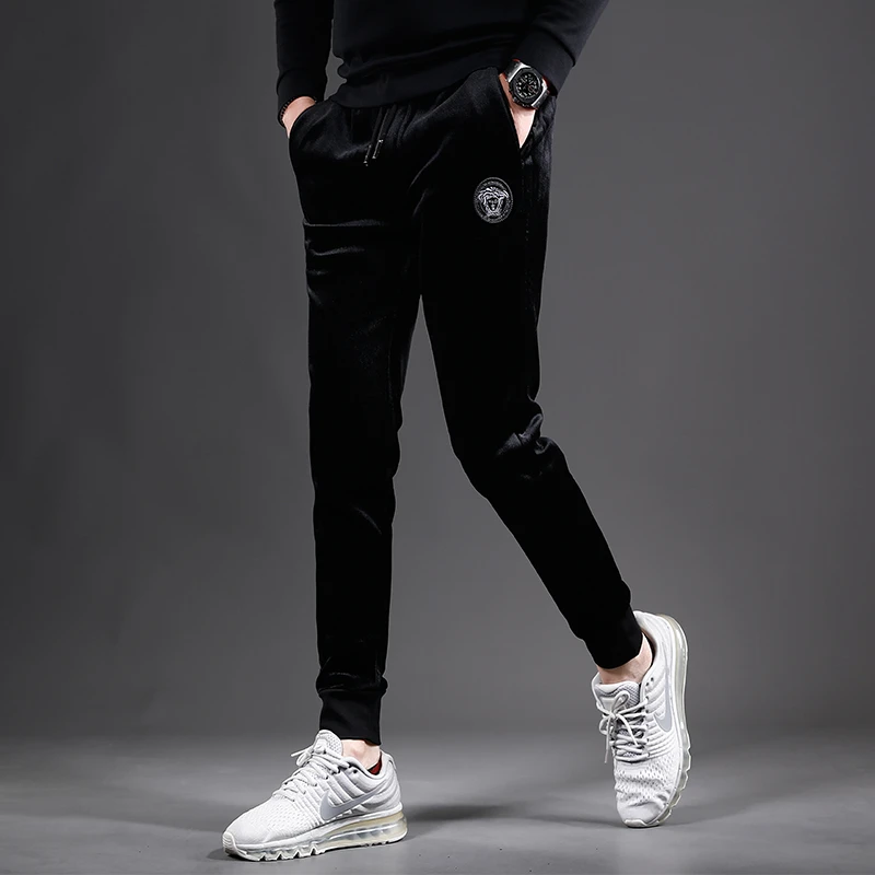 高档潮牌黑色保暖男裤2025冬季加绒加厚男士休闲裤弹性修身小脚裤