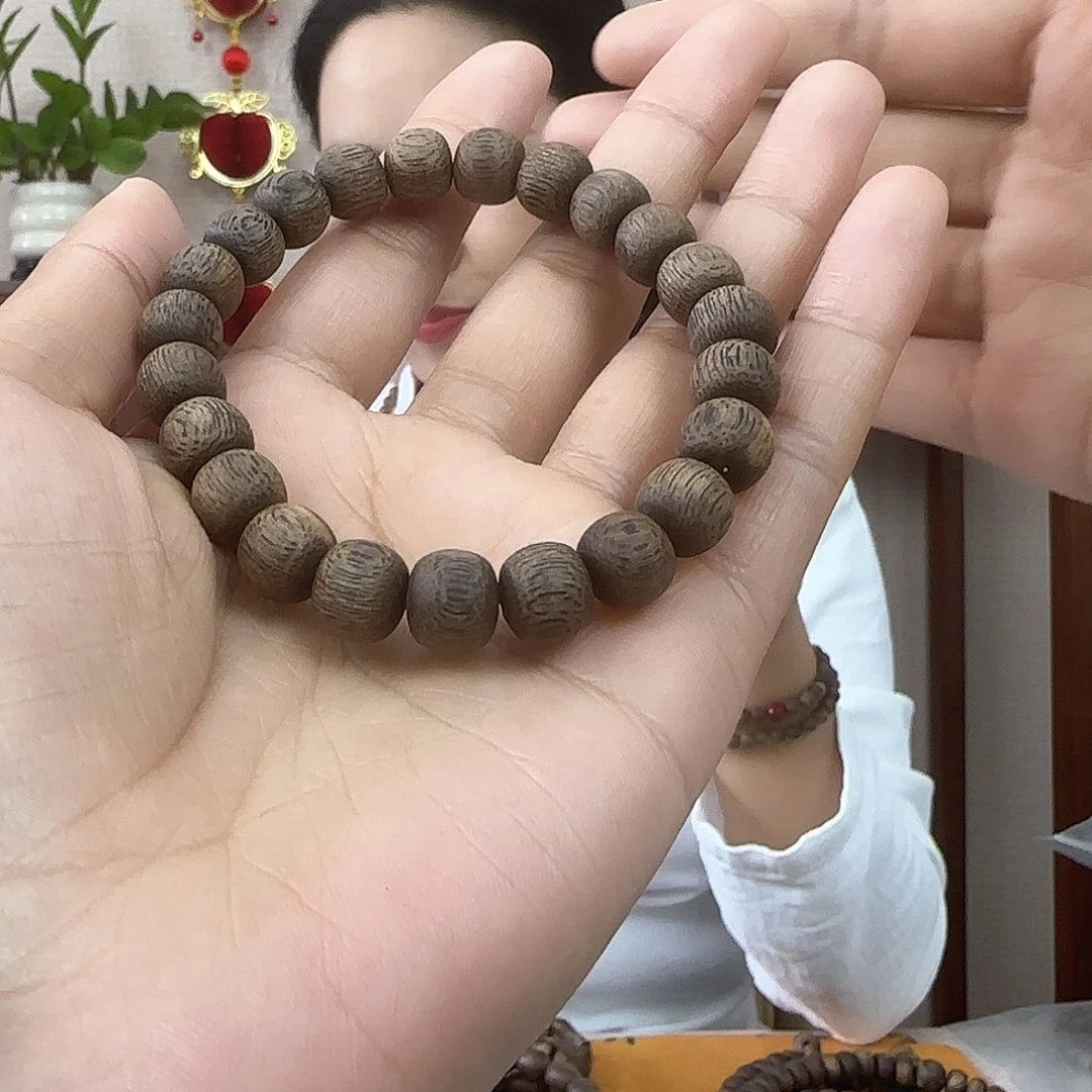 沉香手串维****A海南天然野虫漏黑油格桶珠单圈手串0.9