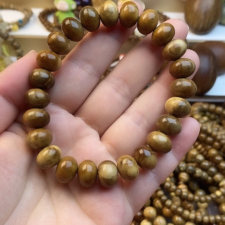 嫣***手串库克库克单圈楼兰妖花算盘