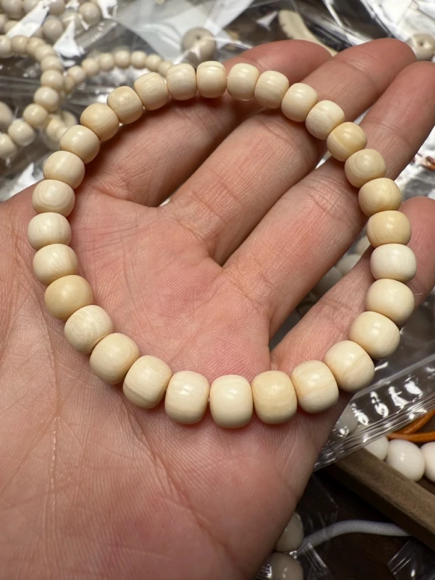 Y1100天然猛犸牙芝士皮老型手串7x6