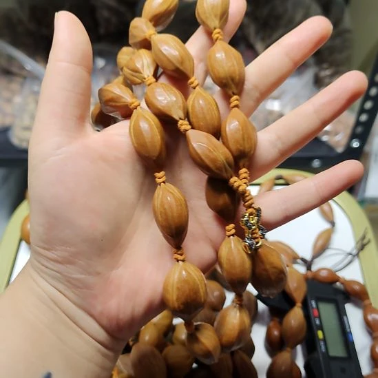 垚***光吊坠橄榄核四花脖挂