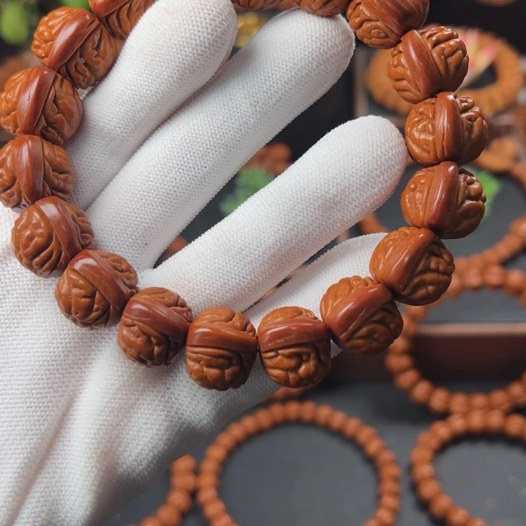 桃核吊坠上*1.7红皮荔枝手串