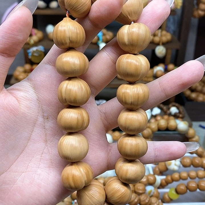 雨****猴头核桃把件猴头屁桃18.7素圈玉米结