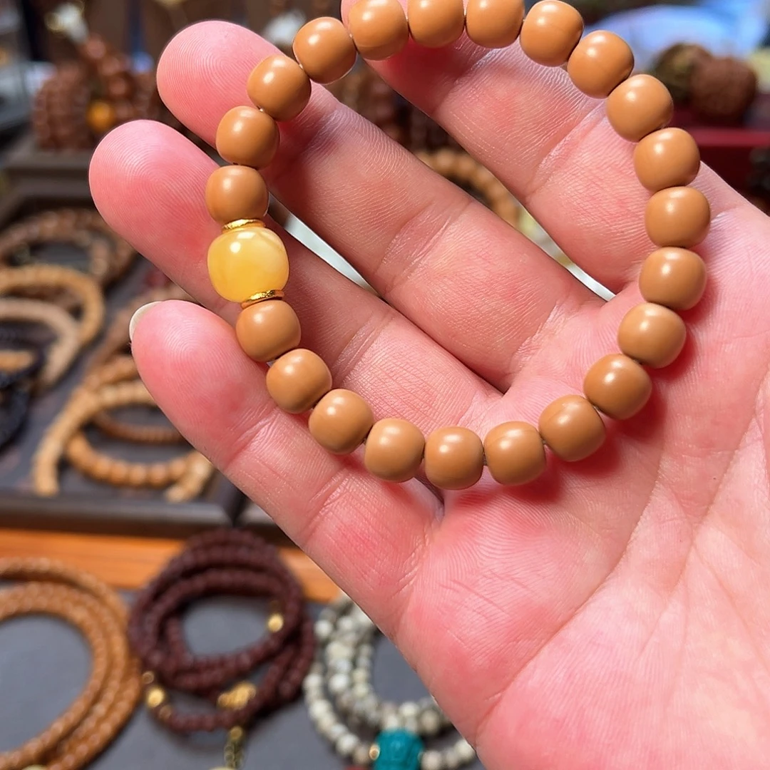 丹***赁橄榄核手串/手链猴头配蜡