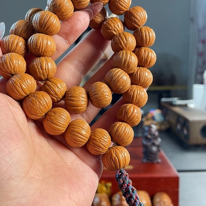 橄榄核吊坠猴头手持