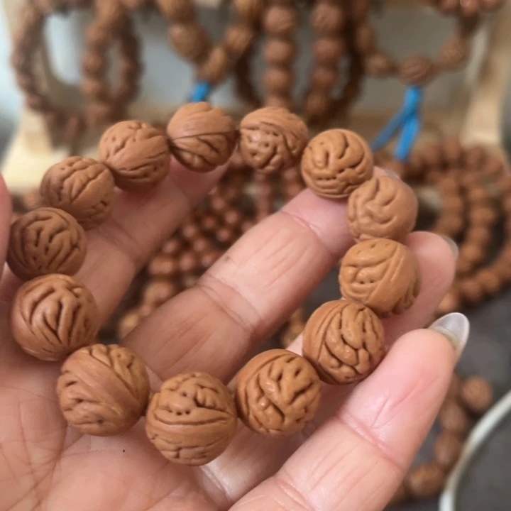 起***點野生桃枭原籽手串