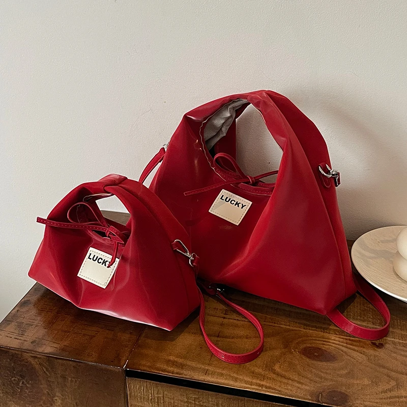 小众设计包包女春夏2025新款时尚红色斜挎包高级感洋气手提饺子包