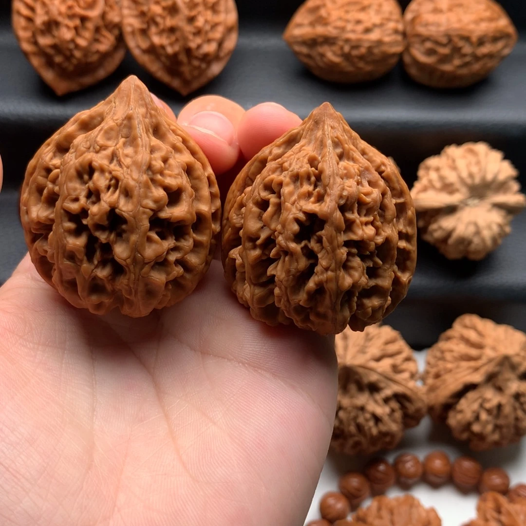 笑***添文玩核桃把件九龙筋