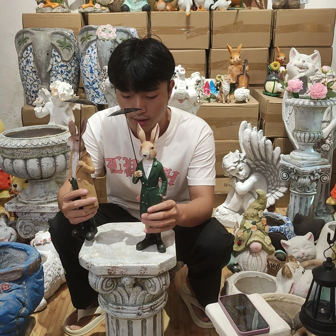 合成树脂打伞兔一对