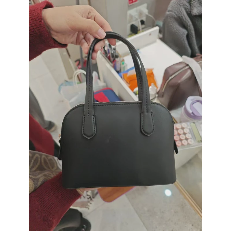 YUSHA/高档黑色阿肉贝壳手提包-3509