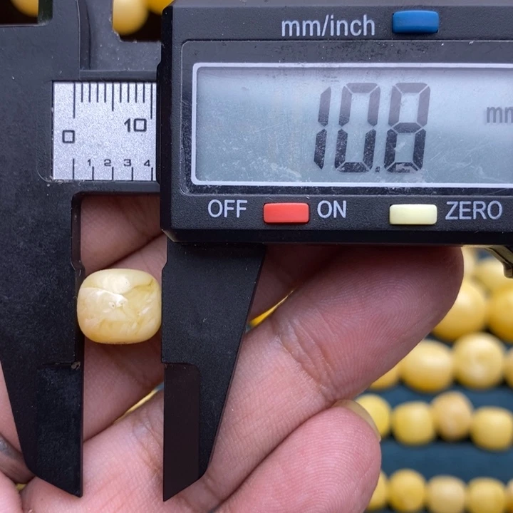 琥珀未镶嵌裸石52号10.8*9.3微瑕孔1.8
