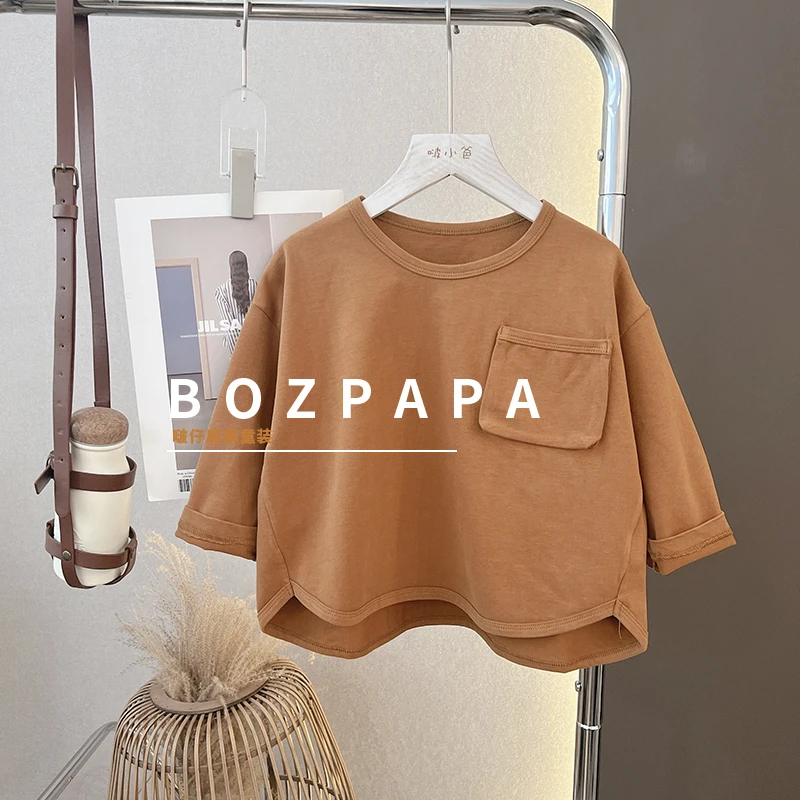 韩版圆弧下摆宽松口袋t