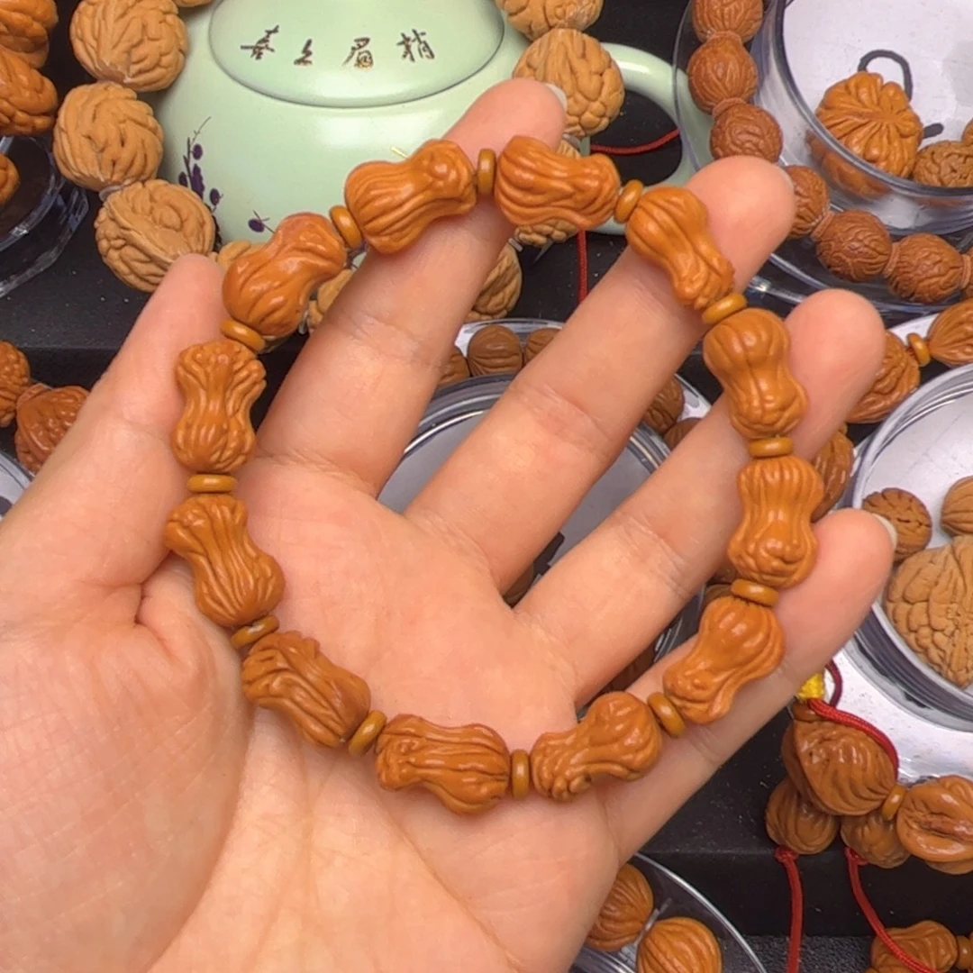 木***李桃核吊坠龙纹桃核手串