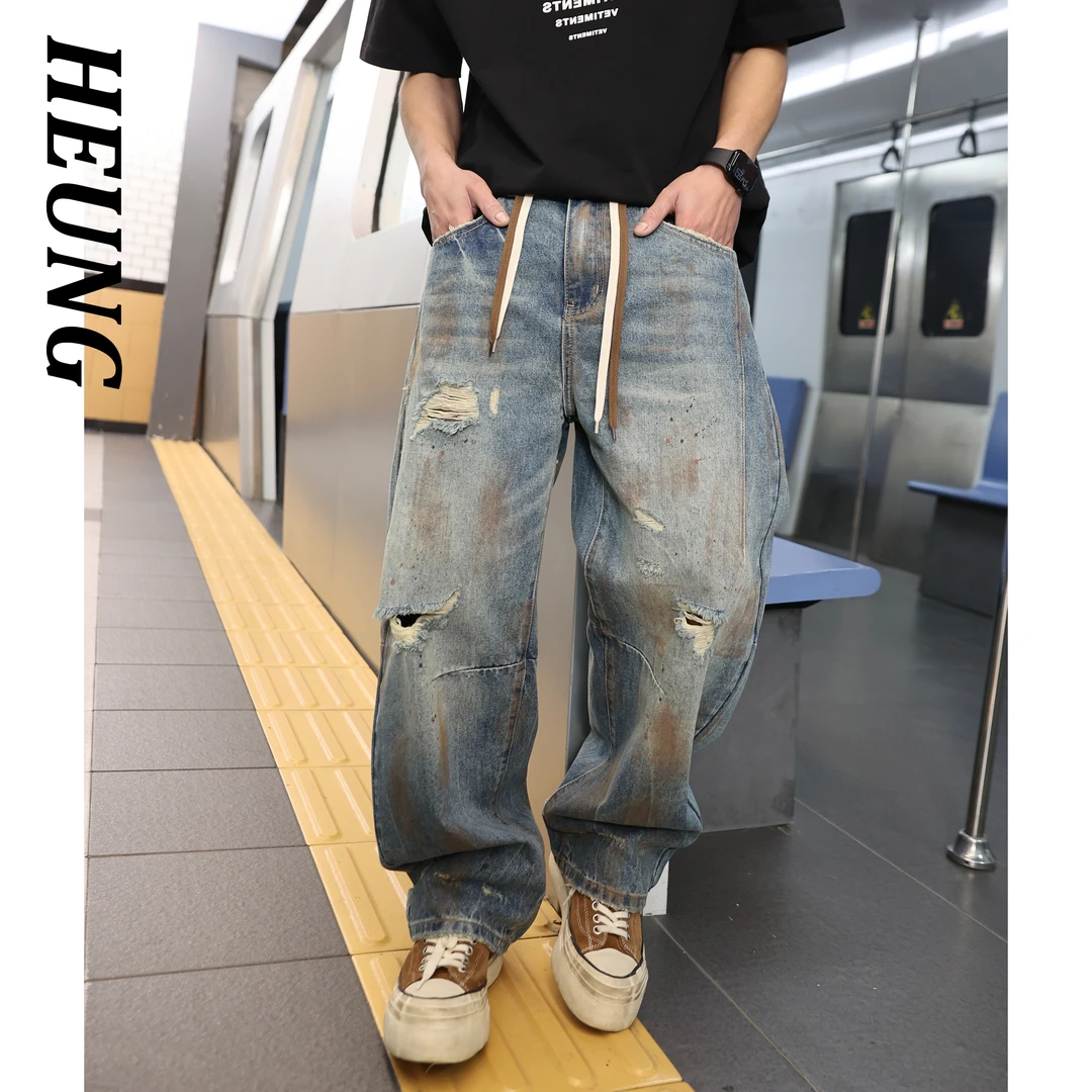 高级设计感痞帅破洞牛仔裤裤子男宽松拼接夏季水洗潮流弯刀长裤