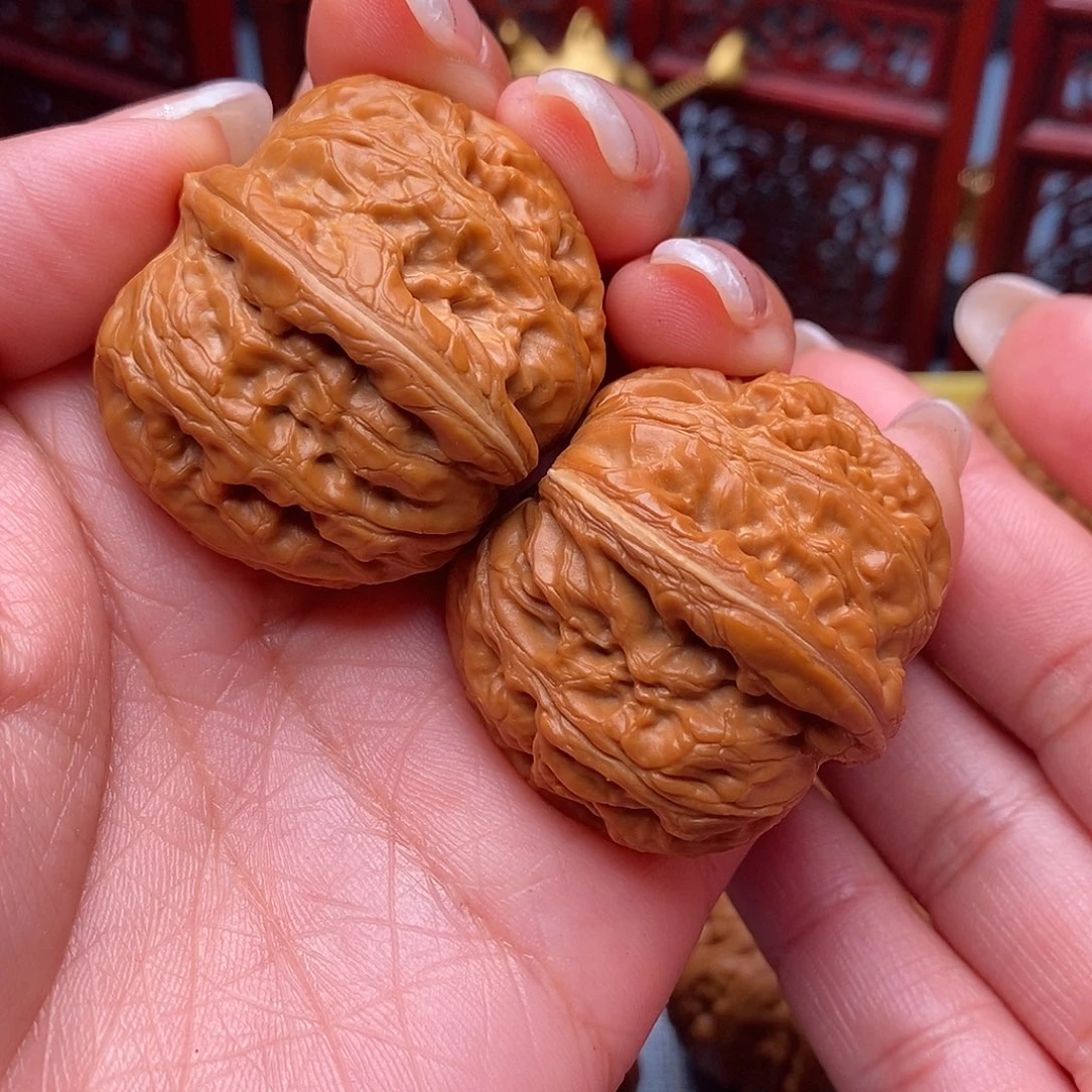 沐***行文玩核桃把件毕业元宝40全品