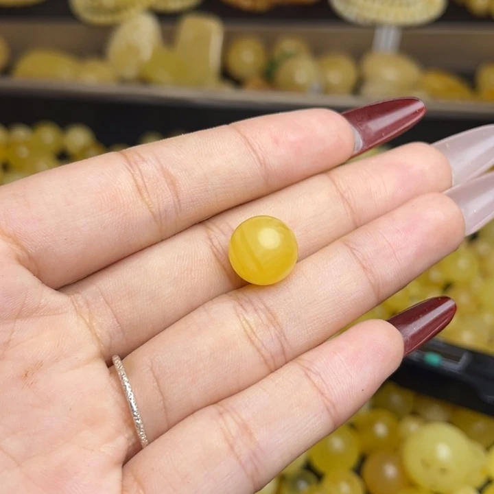 y***1蜜蜡未镶嵌珠宝奇石鸡油黄妖花圆珠微瑕