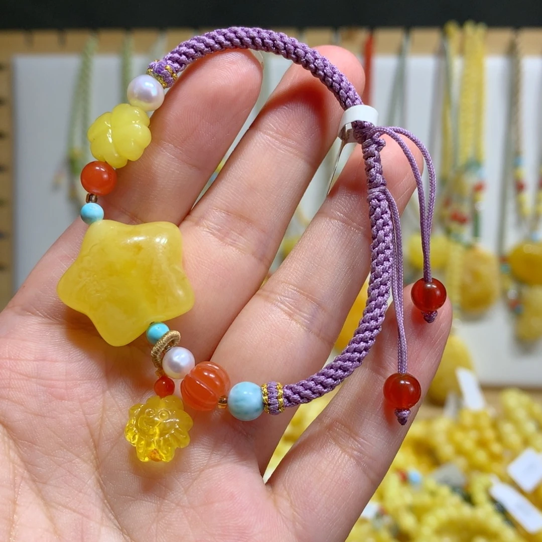 沐***凌未镶嵌蜜蜡手链星星