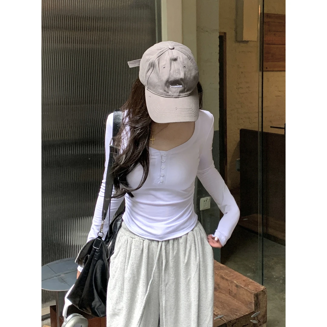 韩版修身显瘦纯欲纽扣褶皱设计感长袖T恤女绝美别致辣妹气质上衣