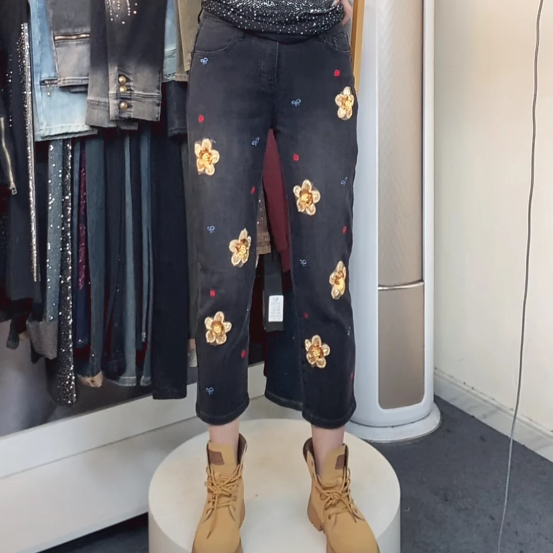 牛仔裤黑色刺绣时尚设计师珠片绣黄色亮片花休闲裤修身长