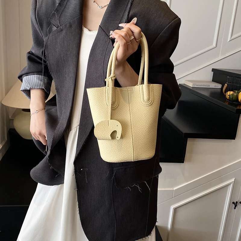 小包包磁扣水桶包千金风斜挎包轻奢纯色女士百搭荔枝纹-9363