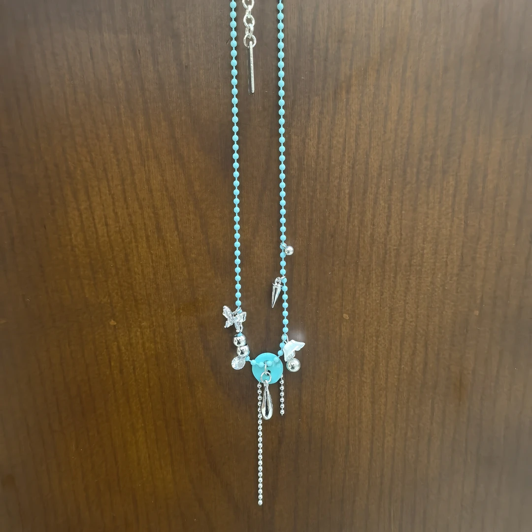 D585蓝色纽扣流苏蝴蝶闪闪项链