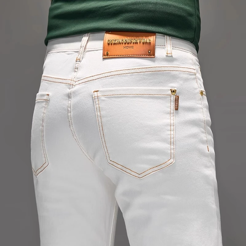 臣吾2025春夏新款轻奢白色牛仔裤男款欧版修身小直筒休闲百搭裤子