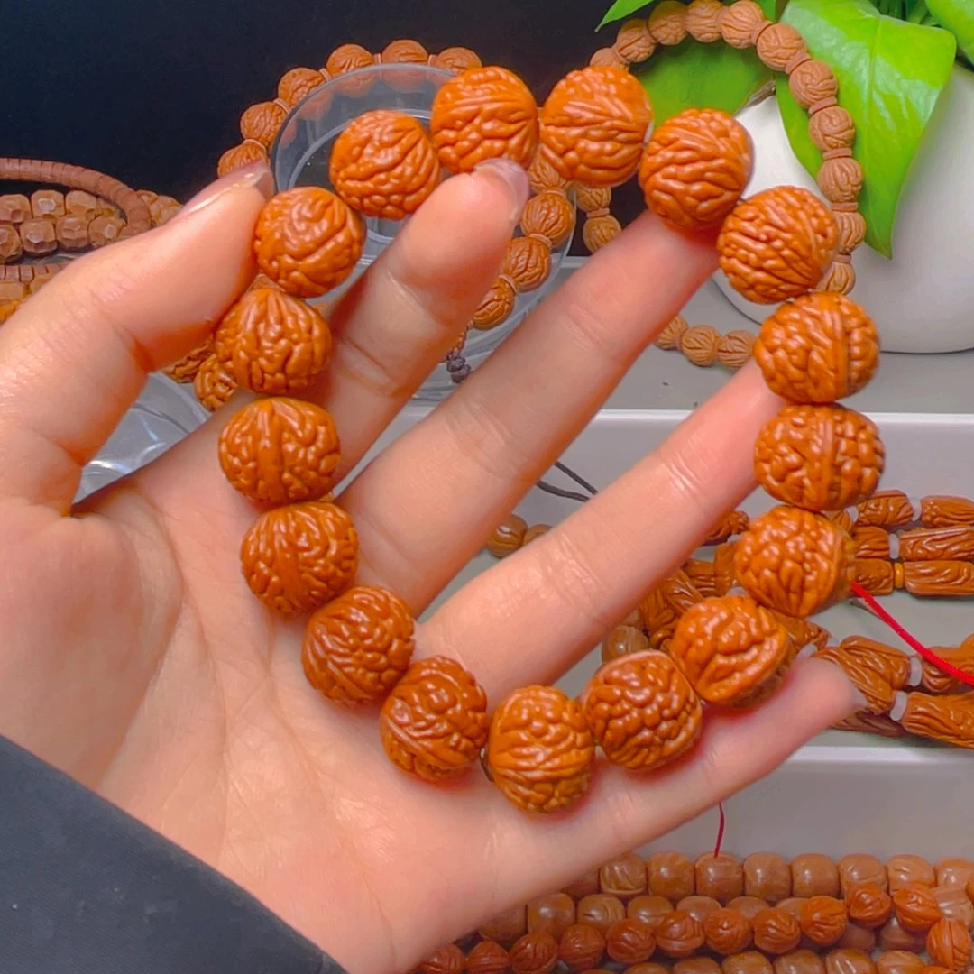 小***松秦岭龙纹桃核手串