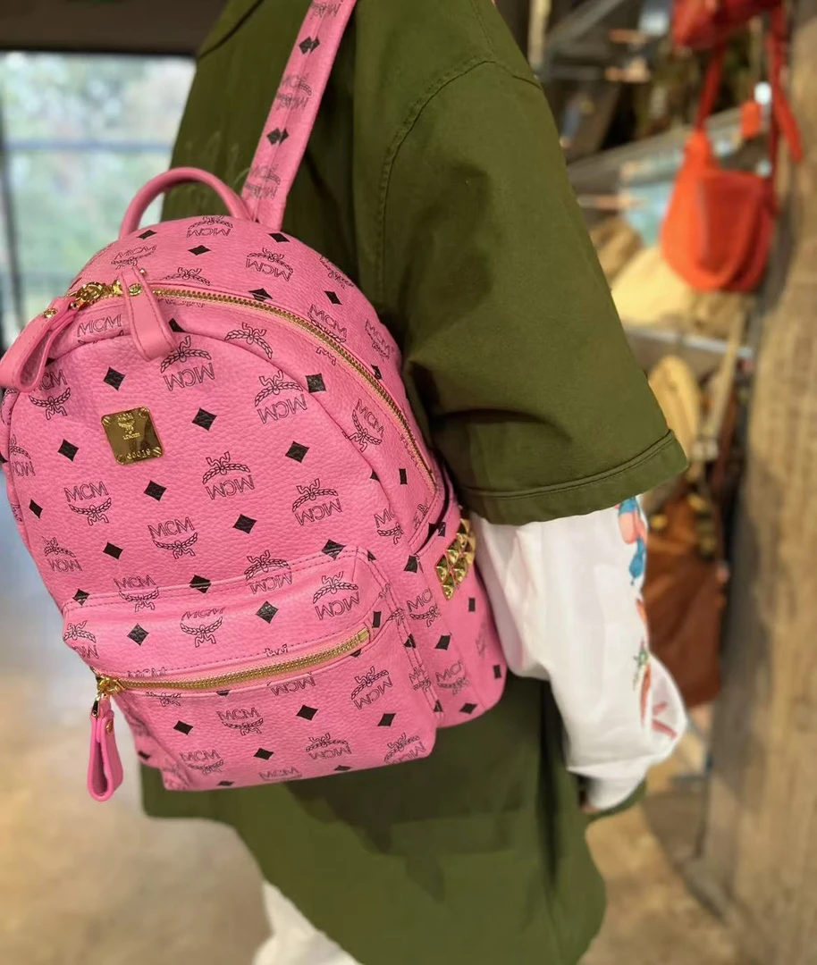 95新 MCM mcm粉色中号双肩包