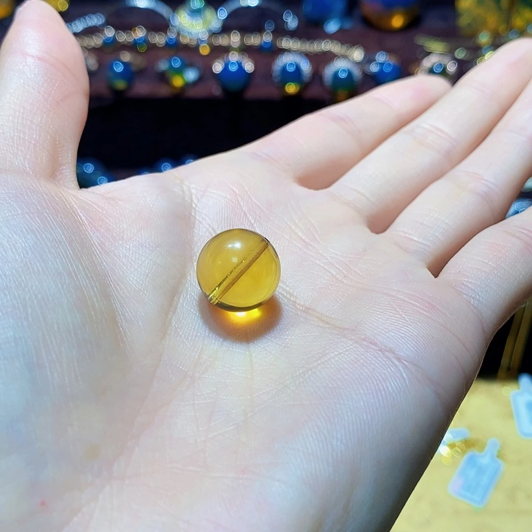 若***为未镶嵌蓝珀裸石13mm高蓝净水打孔裸珠