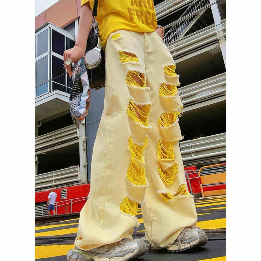 黄色破洞牛仔裤女2025冬季新款设计感不规则小众辣妹宽松阔腿长裤