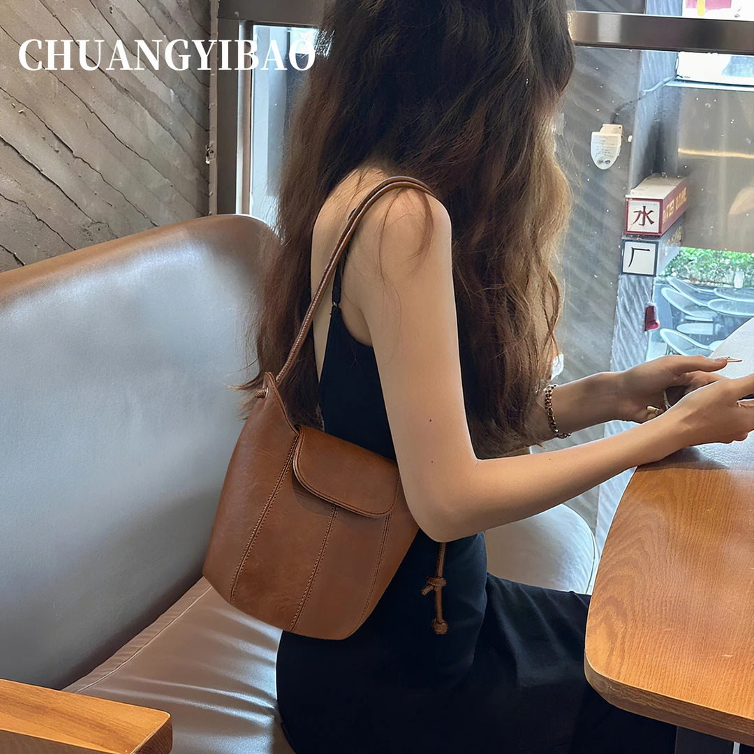 超火棕色爆款马鞍包包女式2025新款秋冬高级感小众通勤斜挎腋下包