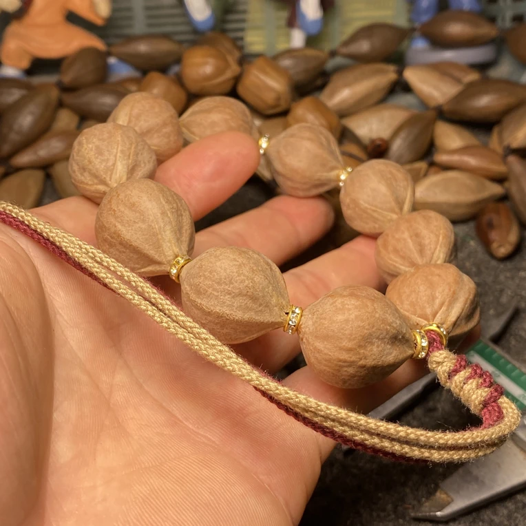 橄榄核正圆手持短圆素串原皮铁核蜜桃臀三通