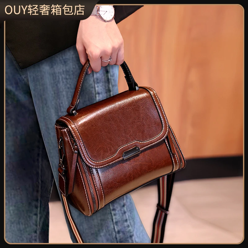 OUY法国轻奢洋气百搭高级感真皮手提女包2025新款单肩斜挎包女士
