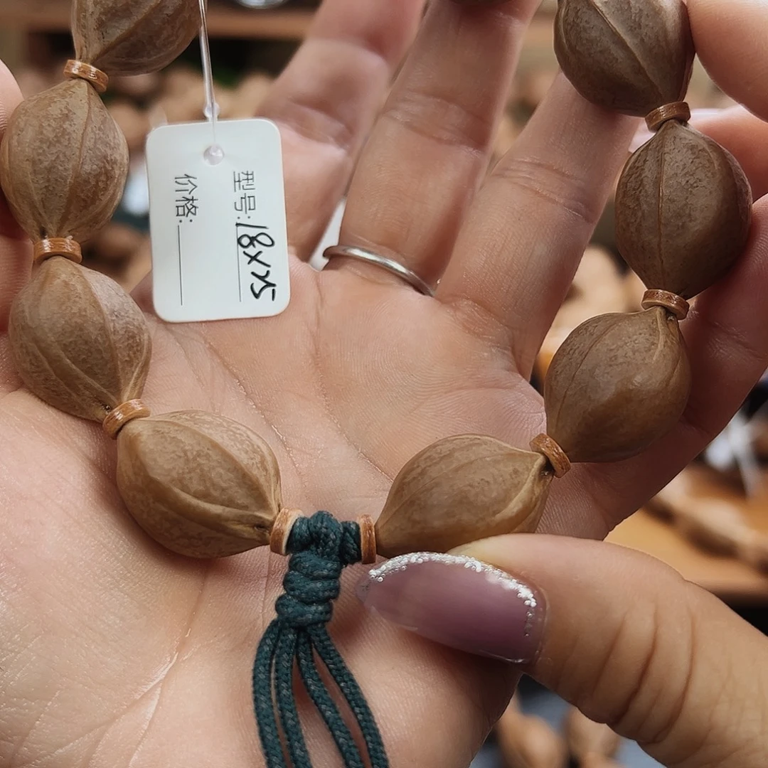 向***赚橄榄核吊坠梅林铁核